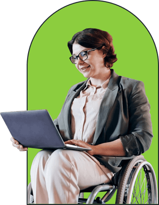 a white woman in a wheelchair looking at her laptop in front of a neon green backdrop